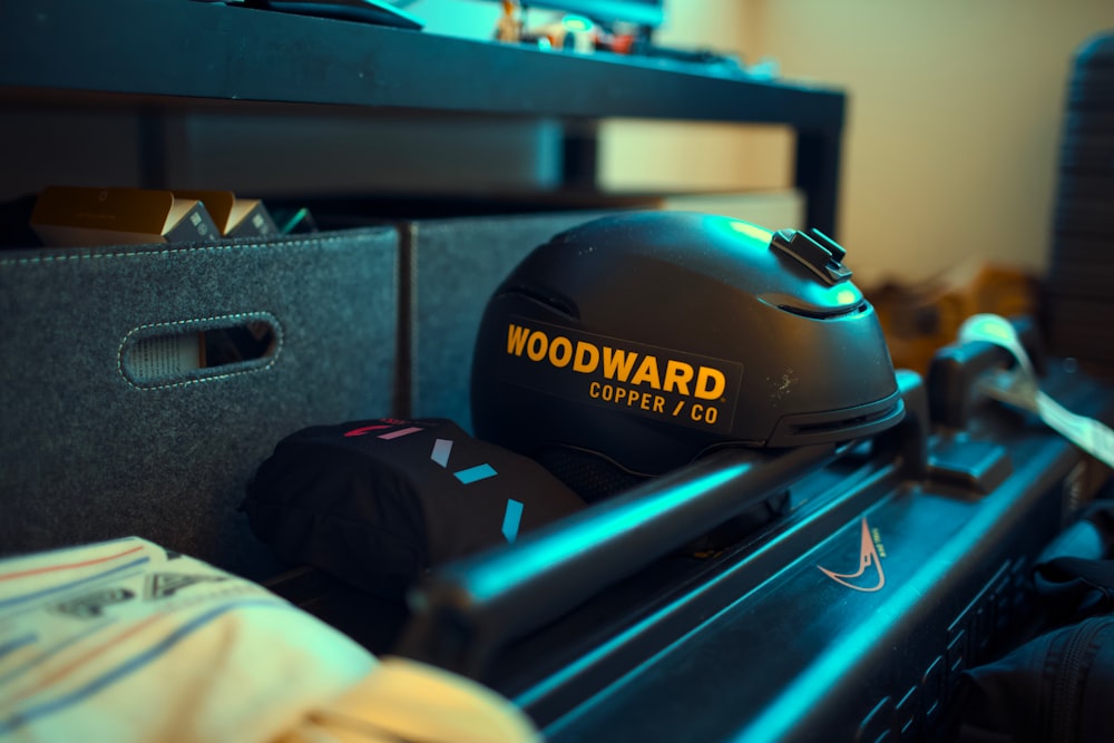 a motorcycle helmet sitting on top of a wooden table