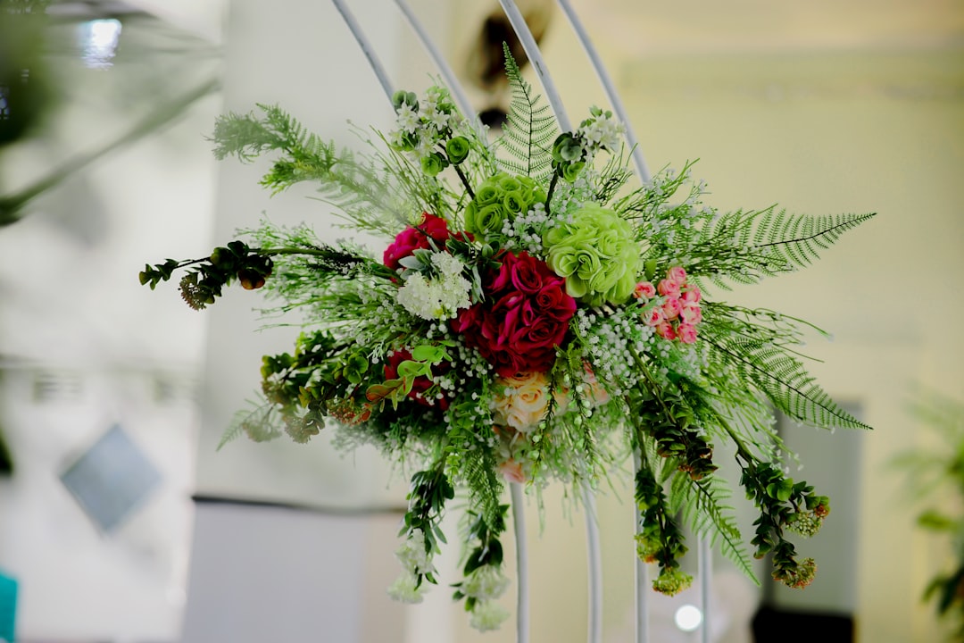 An elegant standing spray of fresh sympathy flowers on an easel An elegant standing spray of fresh sympathy flowers on an easel