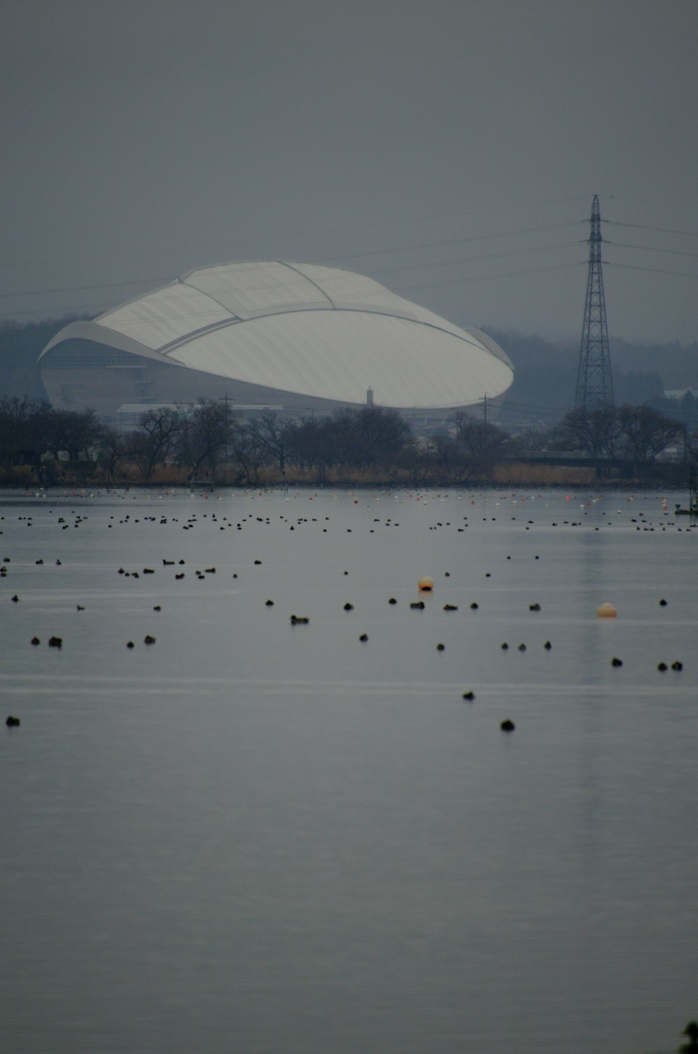 a large white object floating over a large body of water