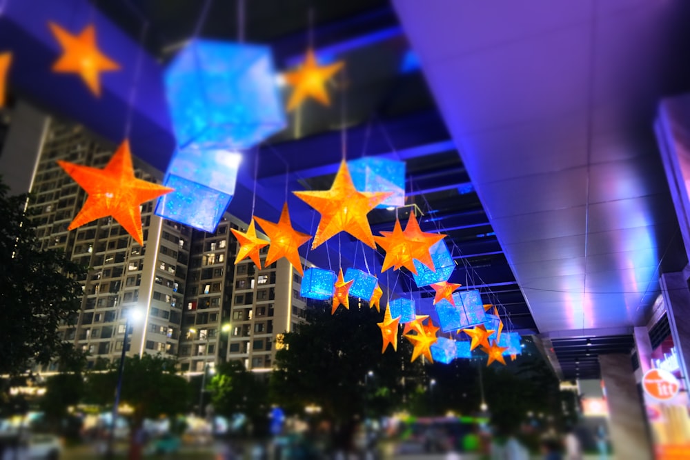 a group of stars hanging from the ceiling of a building