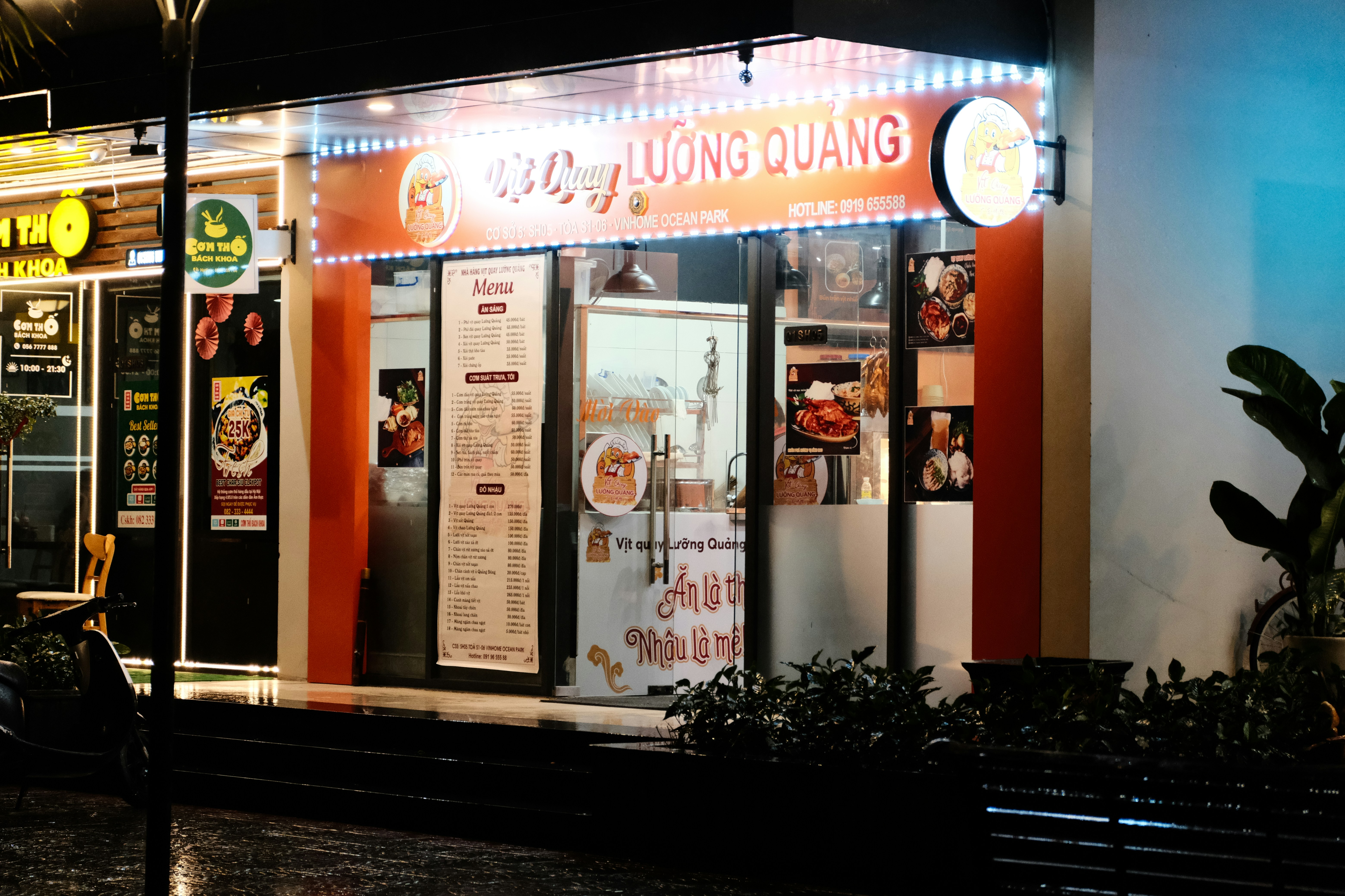 a restaurant with a neon sign on the front of it