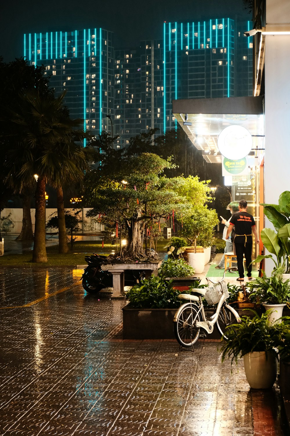 a couple of people that are standing in the rain