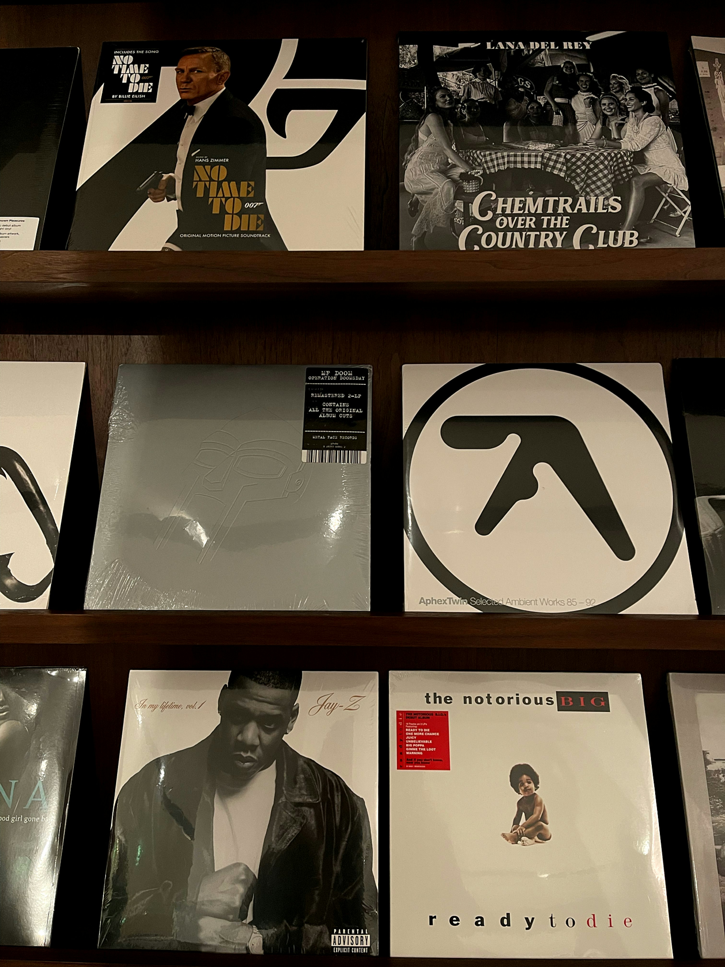 a shelf filled with various cd's and cds