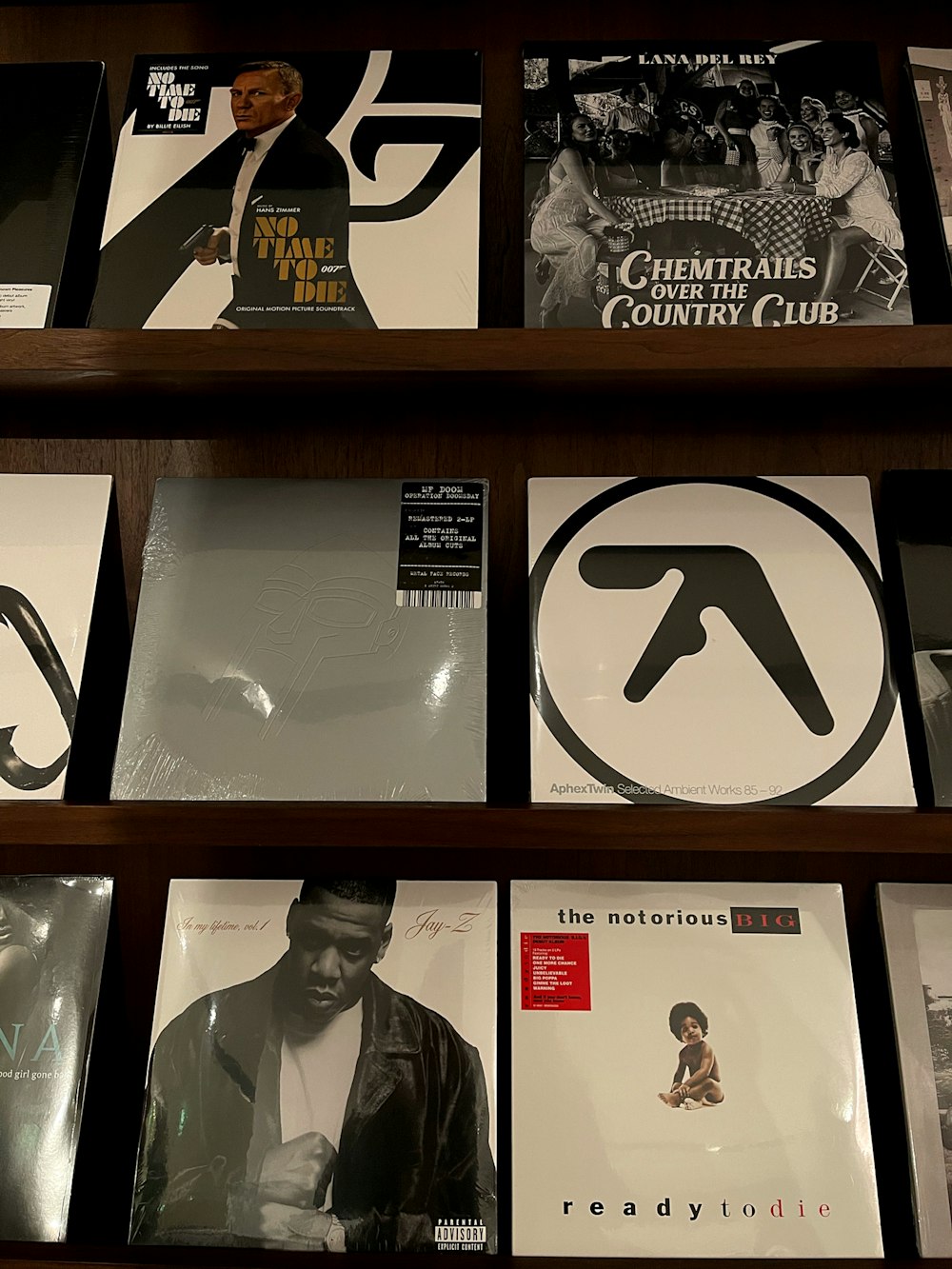 a shelf filled with various cd's and cds