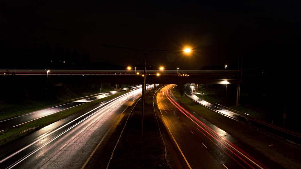 a night time view of a highway with lights