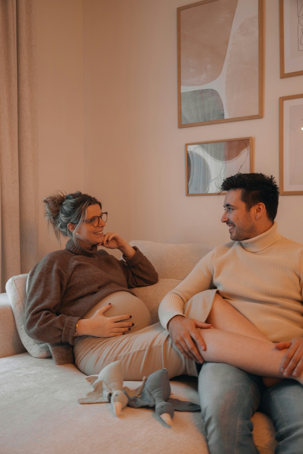 a man and a woman sitting on a couch