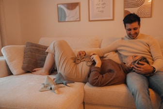 a man and a woman laying on a couch