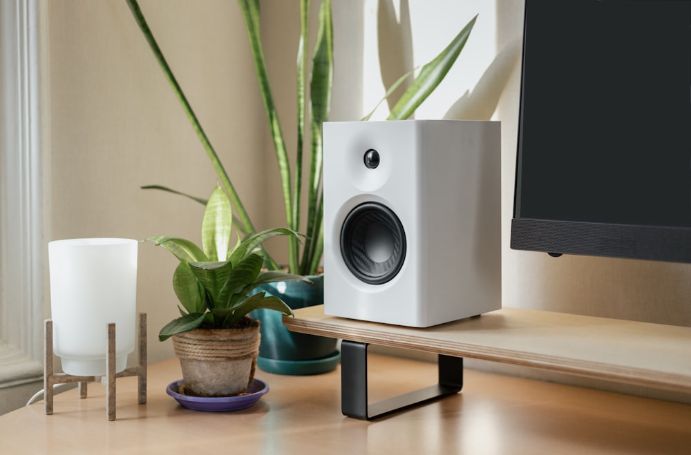 a computer monitor sitting on top of a wooden desk