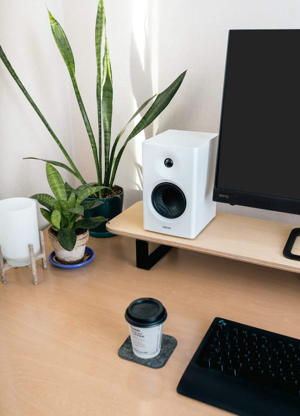 a desktop computer sitting on top of a wooden desk