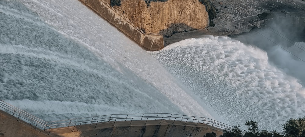 a large waterfall with water coming out of it