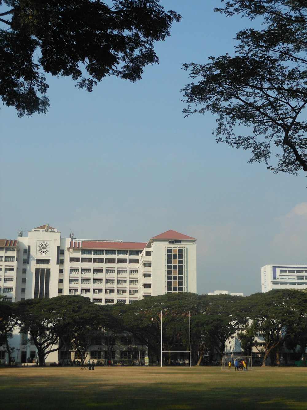 a large white building with a red roof