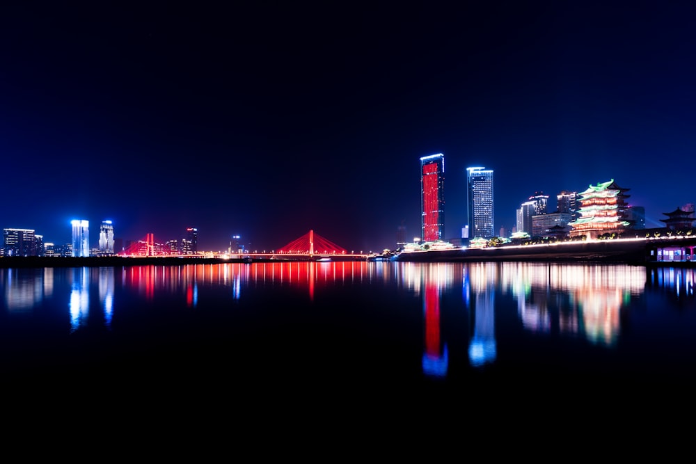 a large body of water with a city in the background