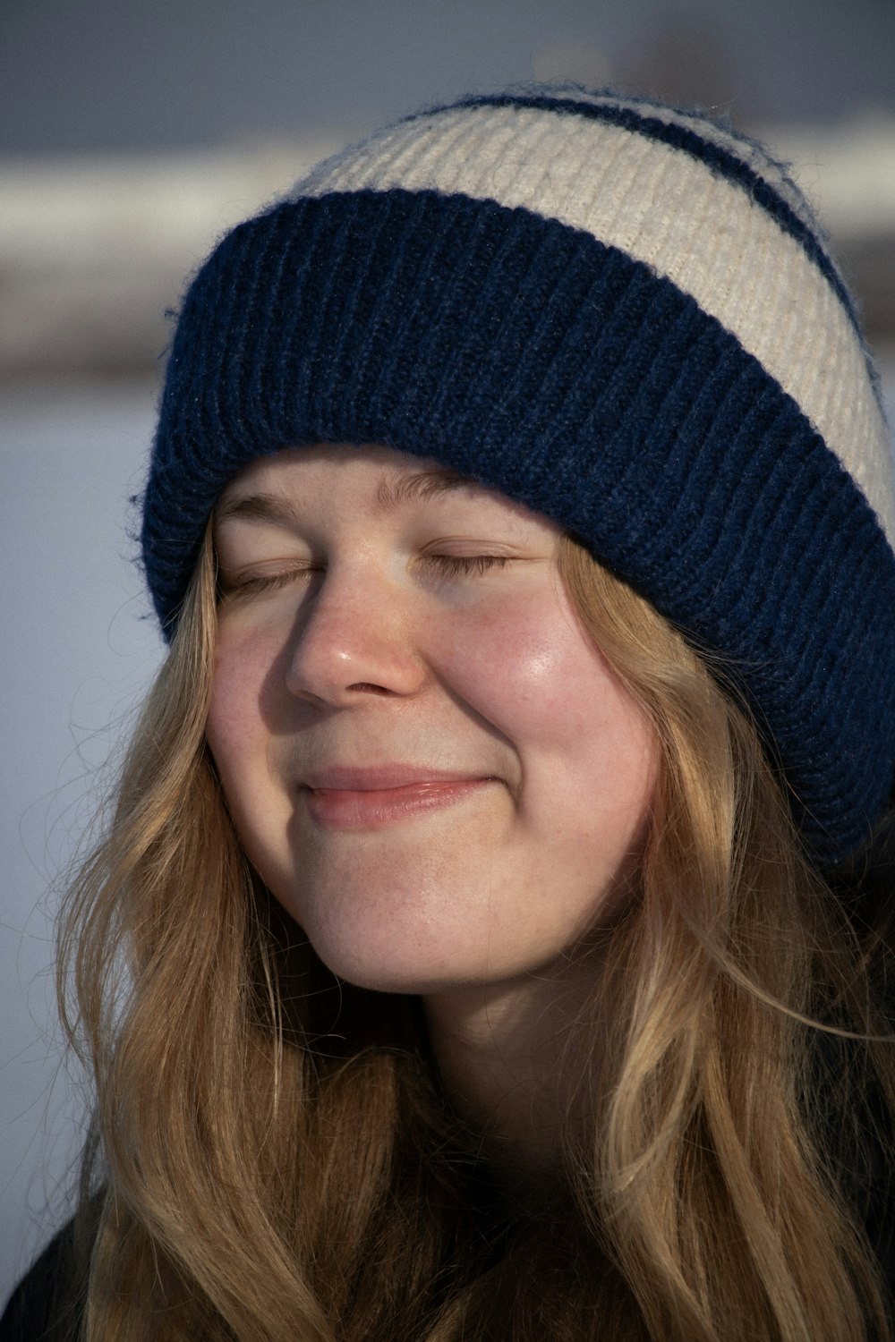 a close up of a person wearing a hat