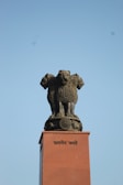 a statue of a lion on top of a building
