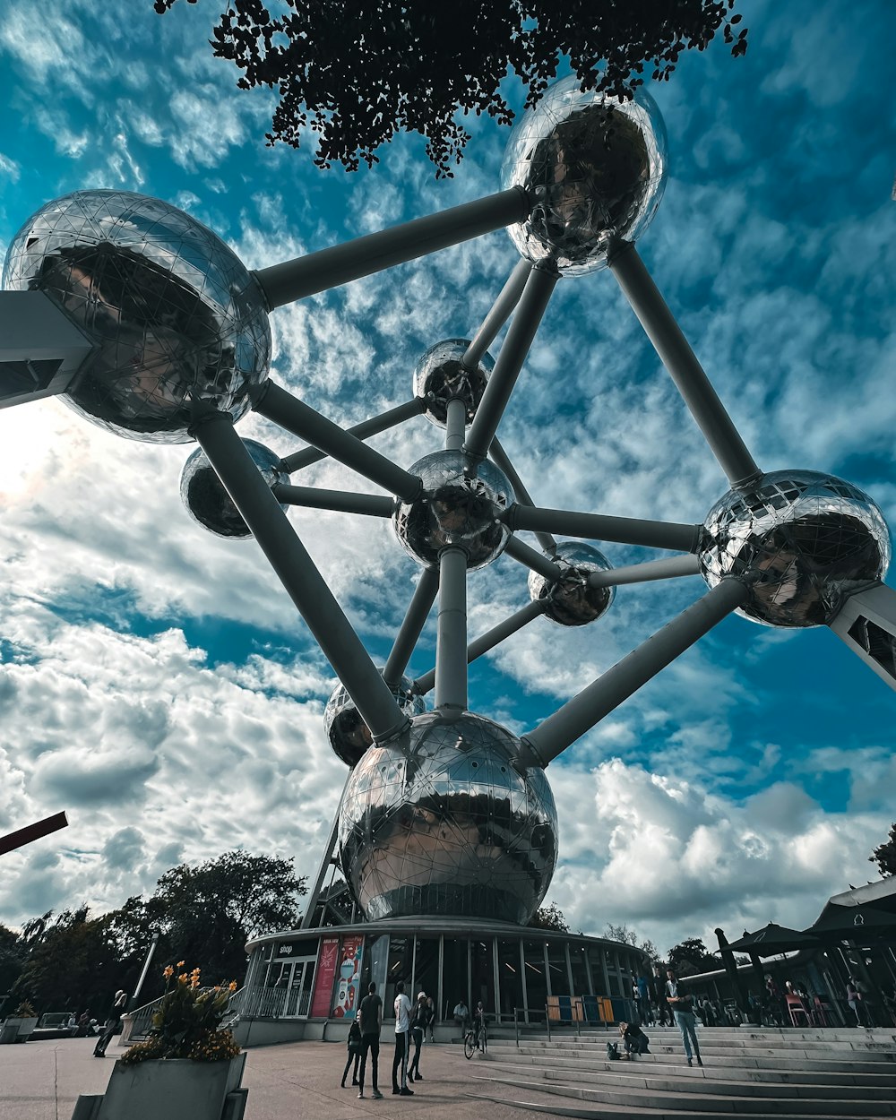 a group of people standing around a metal structure