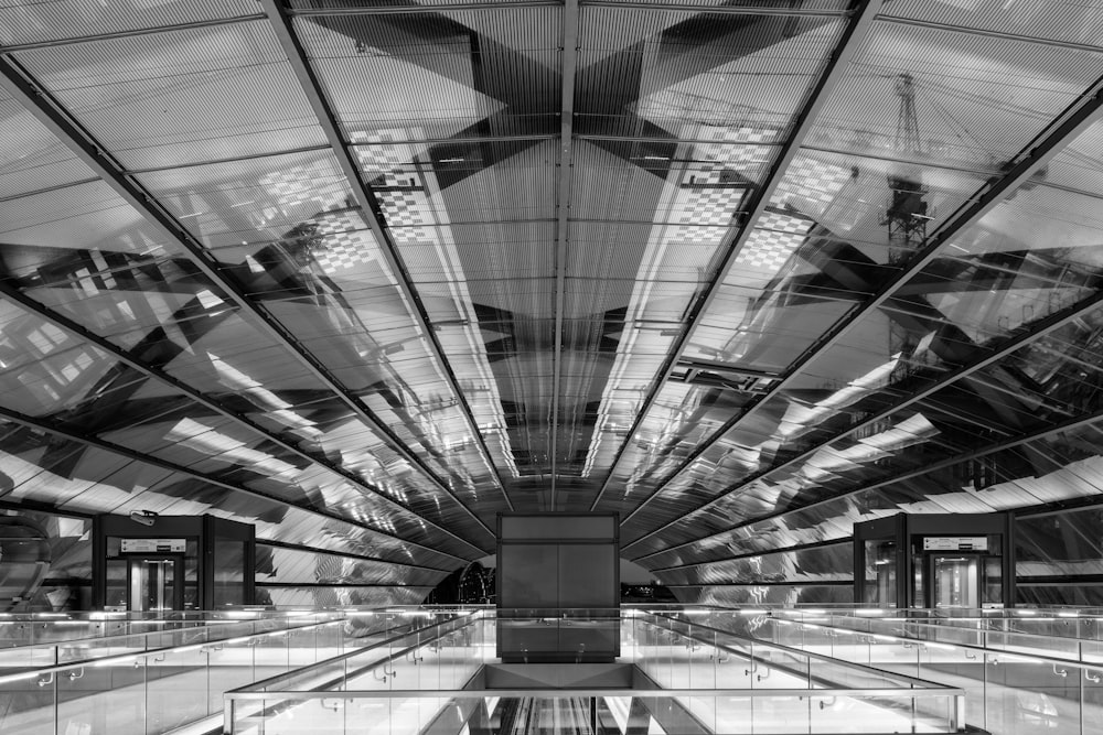 a black and white photo of a subway station