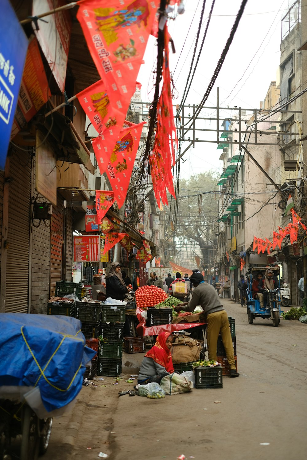 a man standing on the side of a street next to a pile of luggage