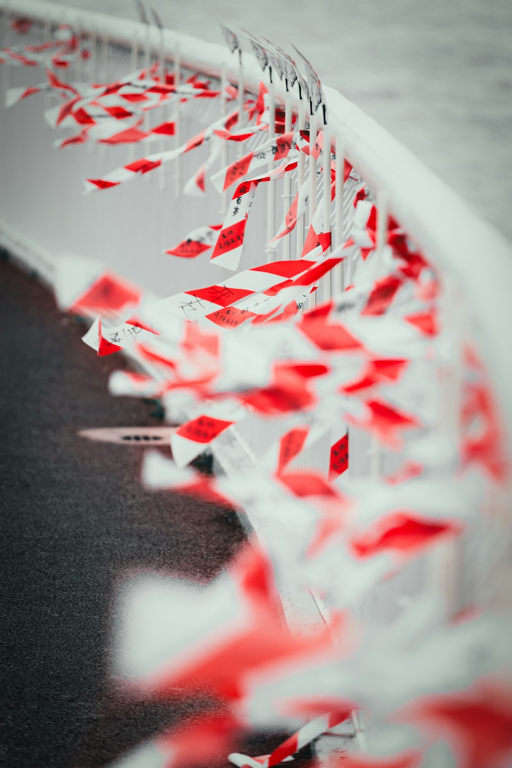 a red and white wall and some red and white flags