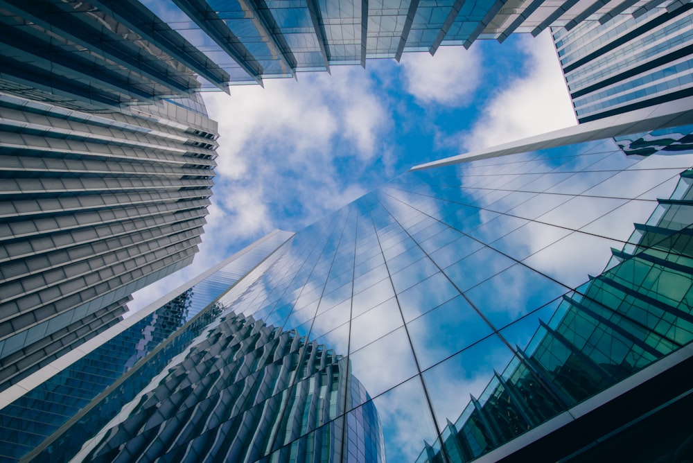 a group of tall buildings with a blue sky in the background