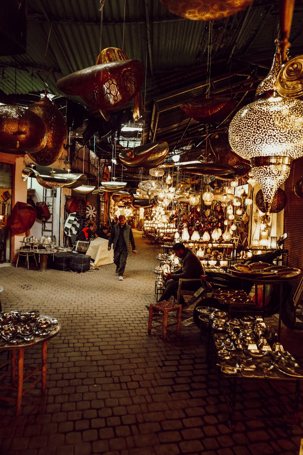 a store filled with lots of lamps and chandeliers