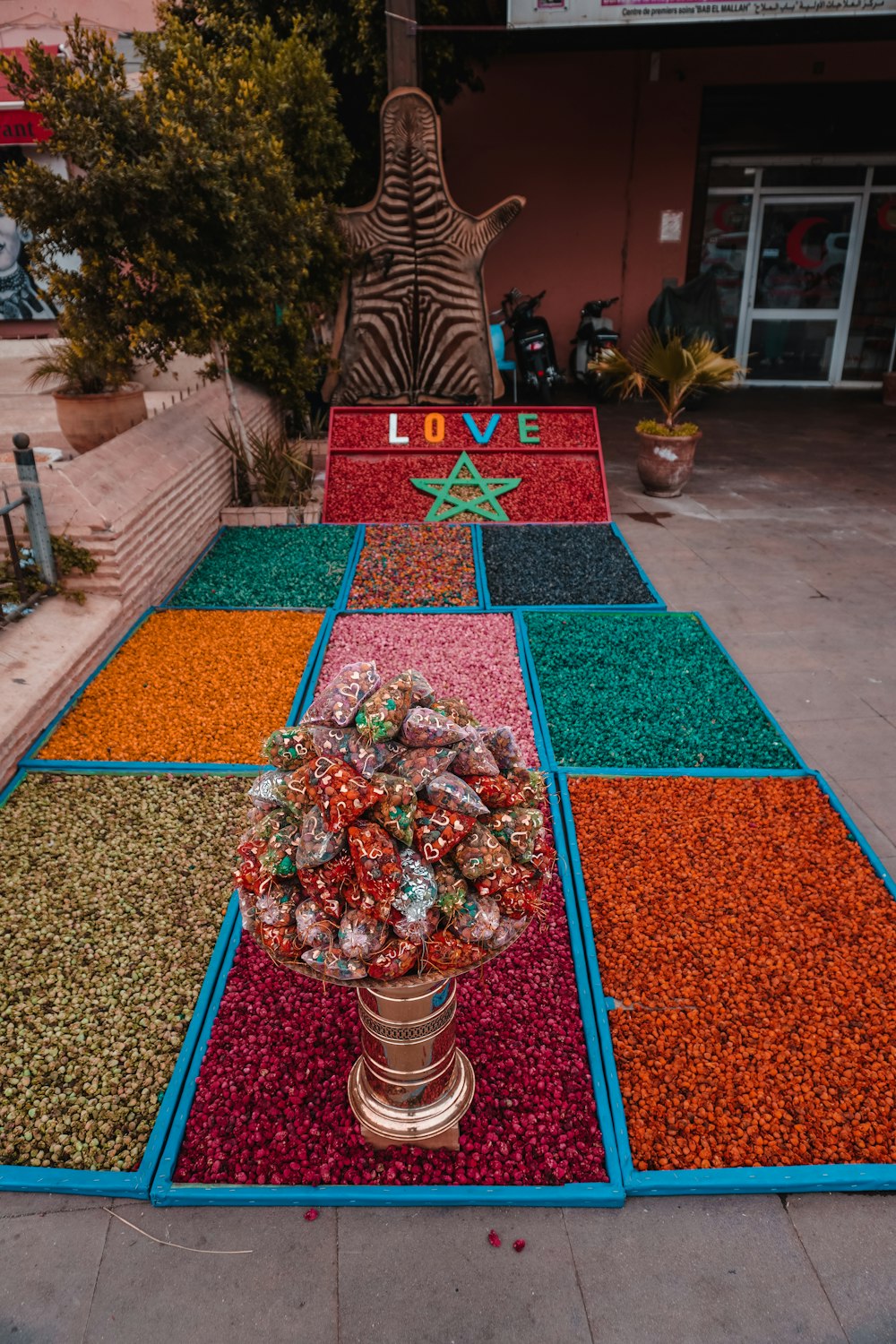 a colorful display of candy and candies on a sidewalk