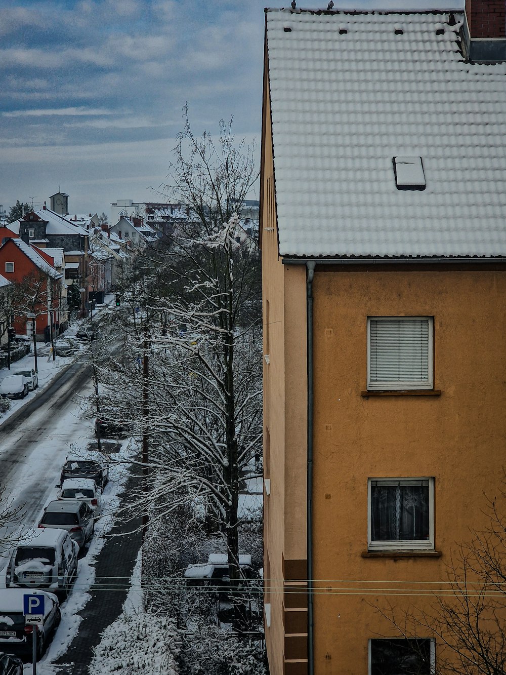 a street with cars parked on the side of it