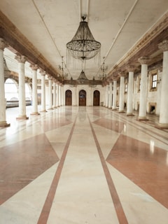 a large room with a chandelier hanging from the ceiling