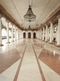 a large room with a chandelier hanging from the ceiling