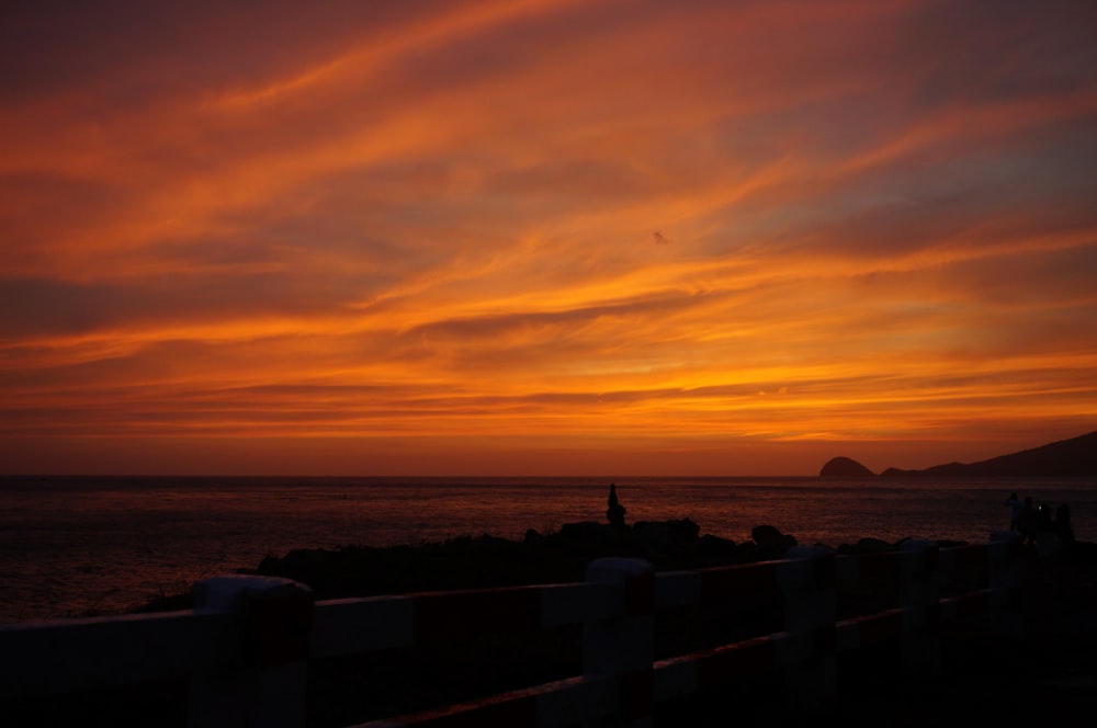 a sunset over a body of water