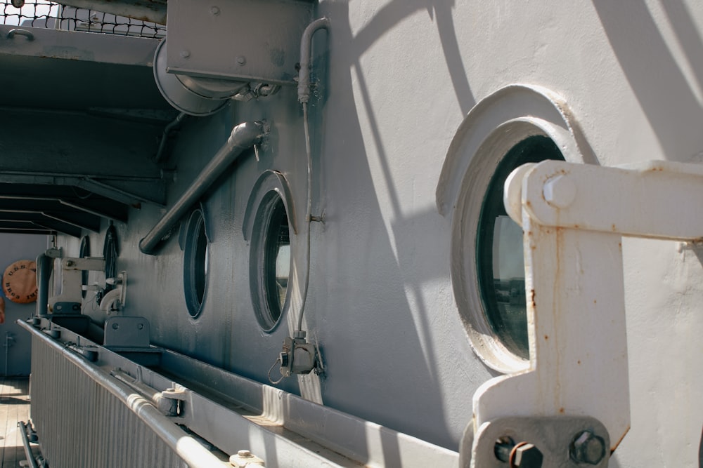 a close up of a boat's windows and railing