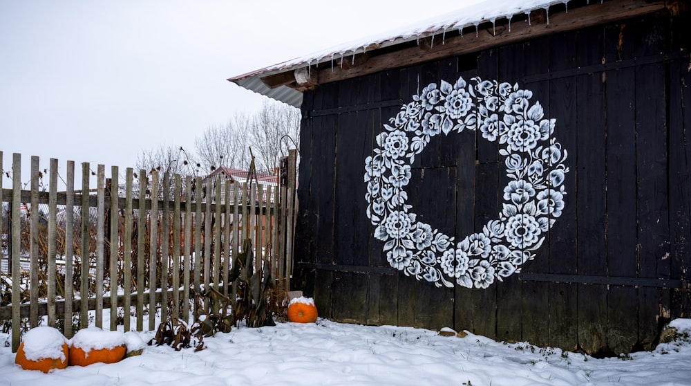 a picture of a wreath on the side of a building