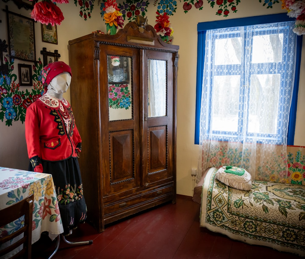 a room with a bed and a cabinet