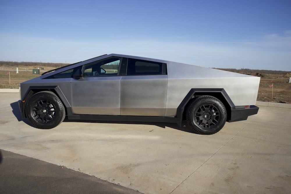 a futuristic car parked in a parking lot