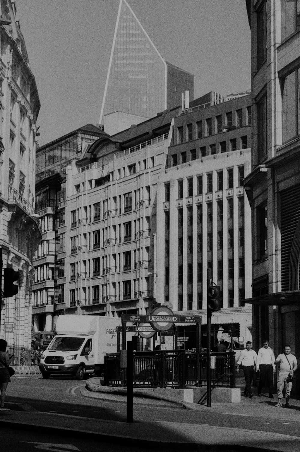 a black and white photo of a city street