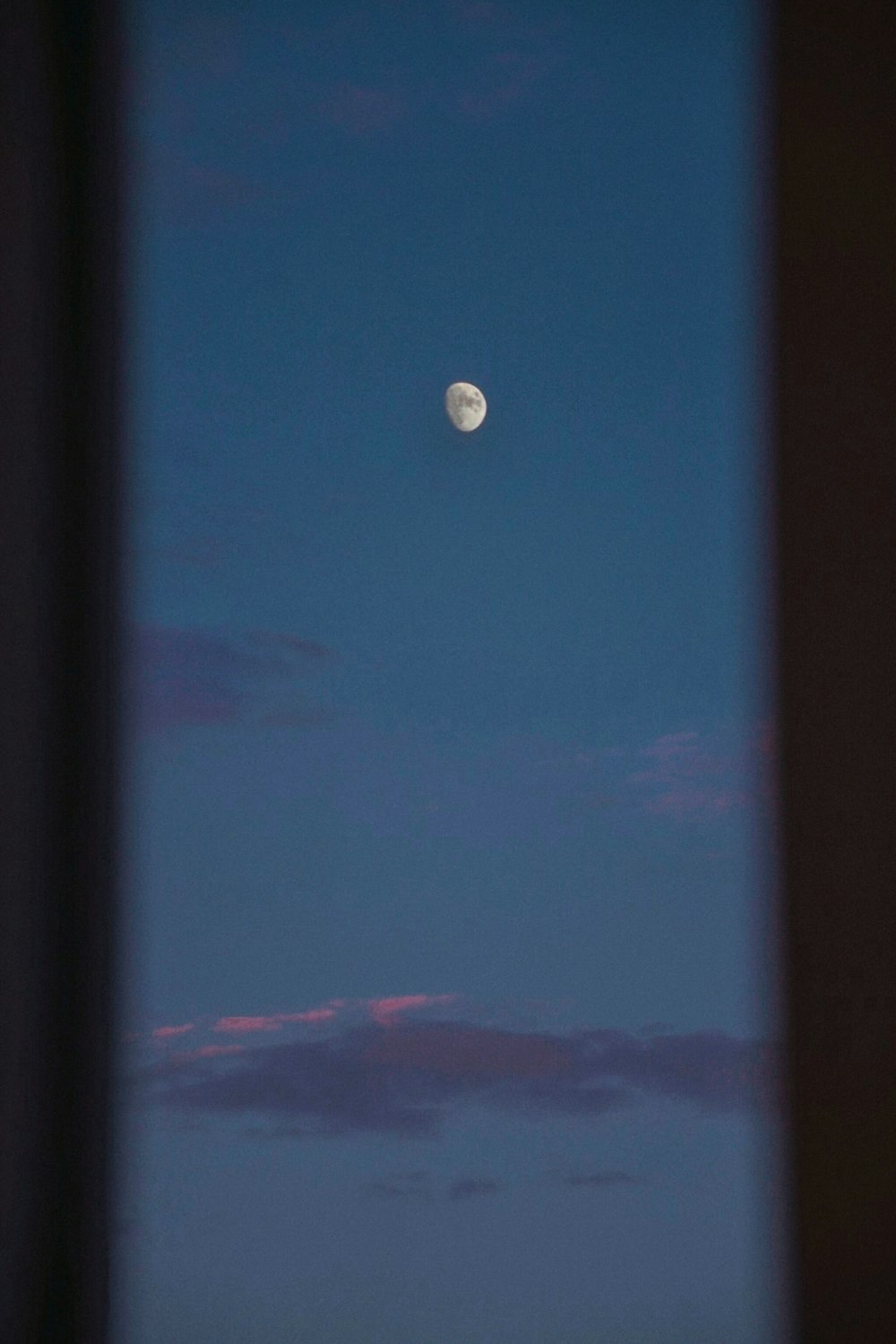 a view of the moon through a window