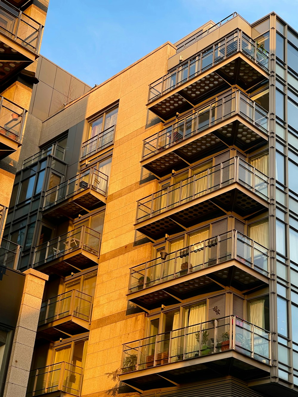 a tall building with balconies and balconies on each floor