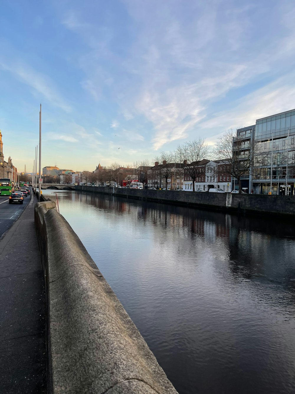 a river running through a city next to tall buildings