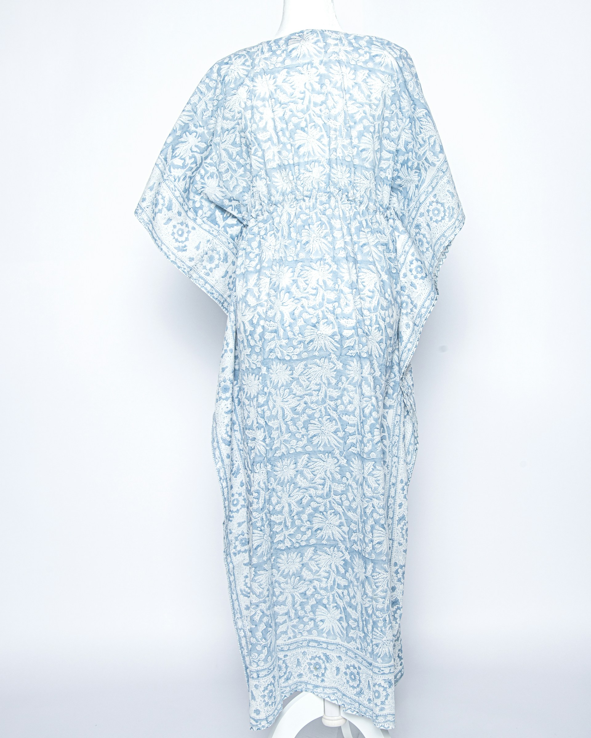 a white and blue dress on a mannequin