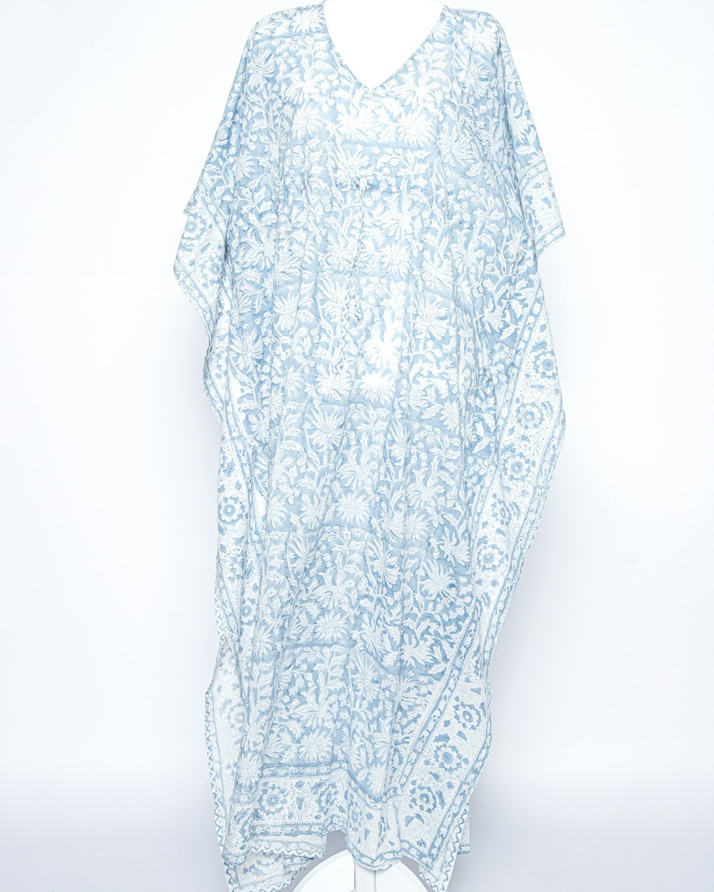 a white and blue dress on a mannequin