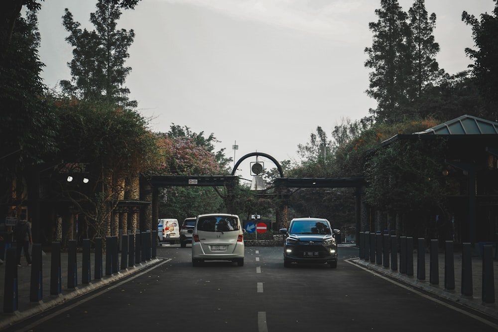 a couple of cars that are sitting in the street