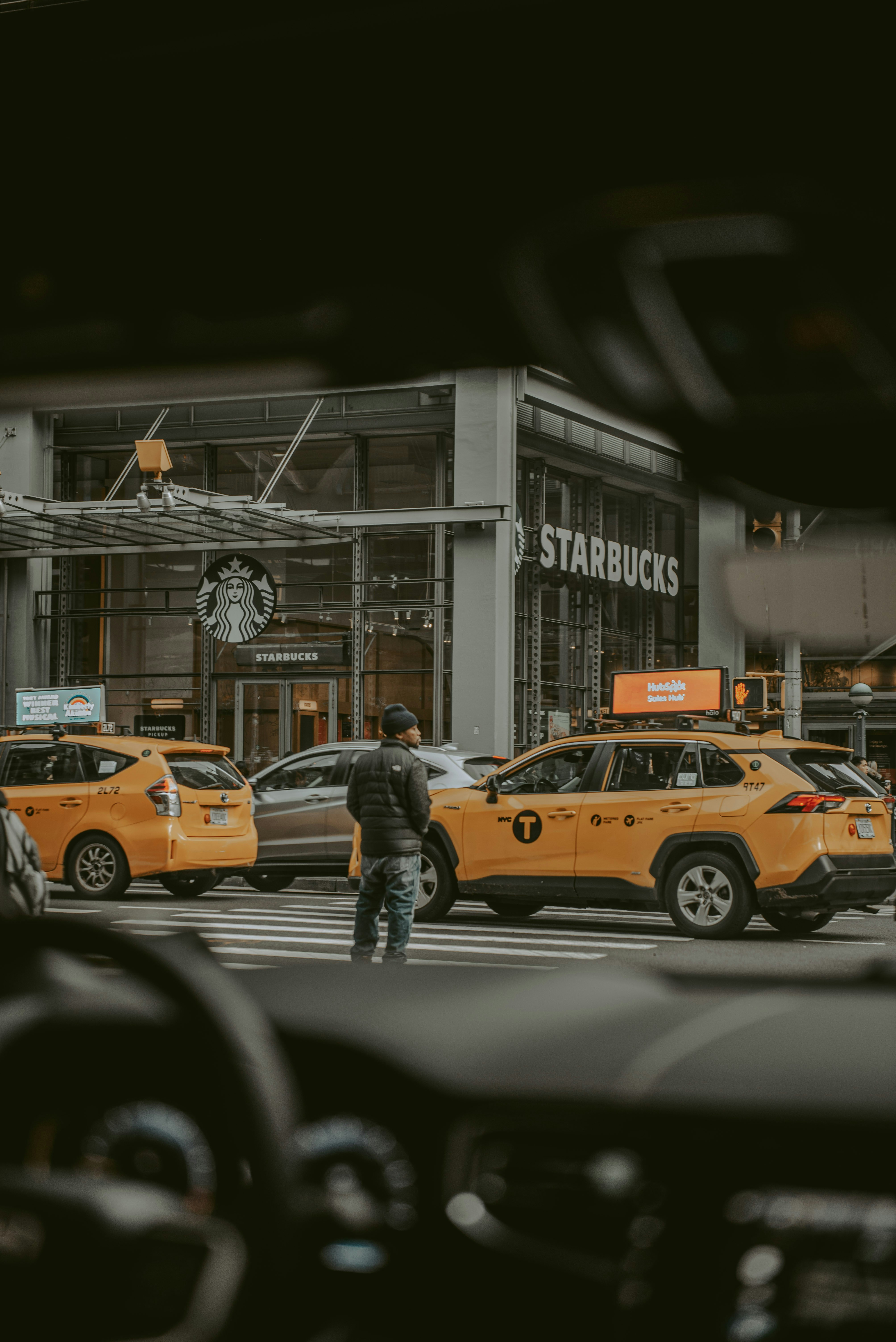 a man standing in the middle of a busy street