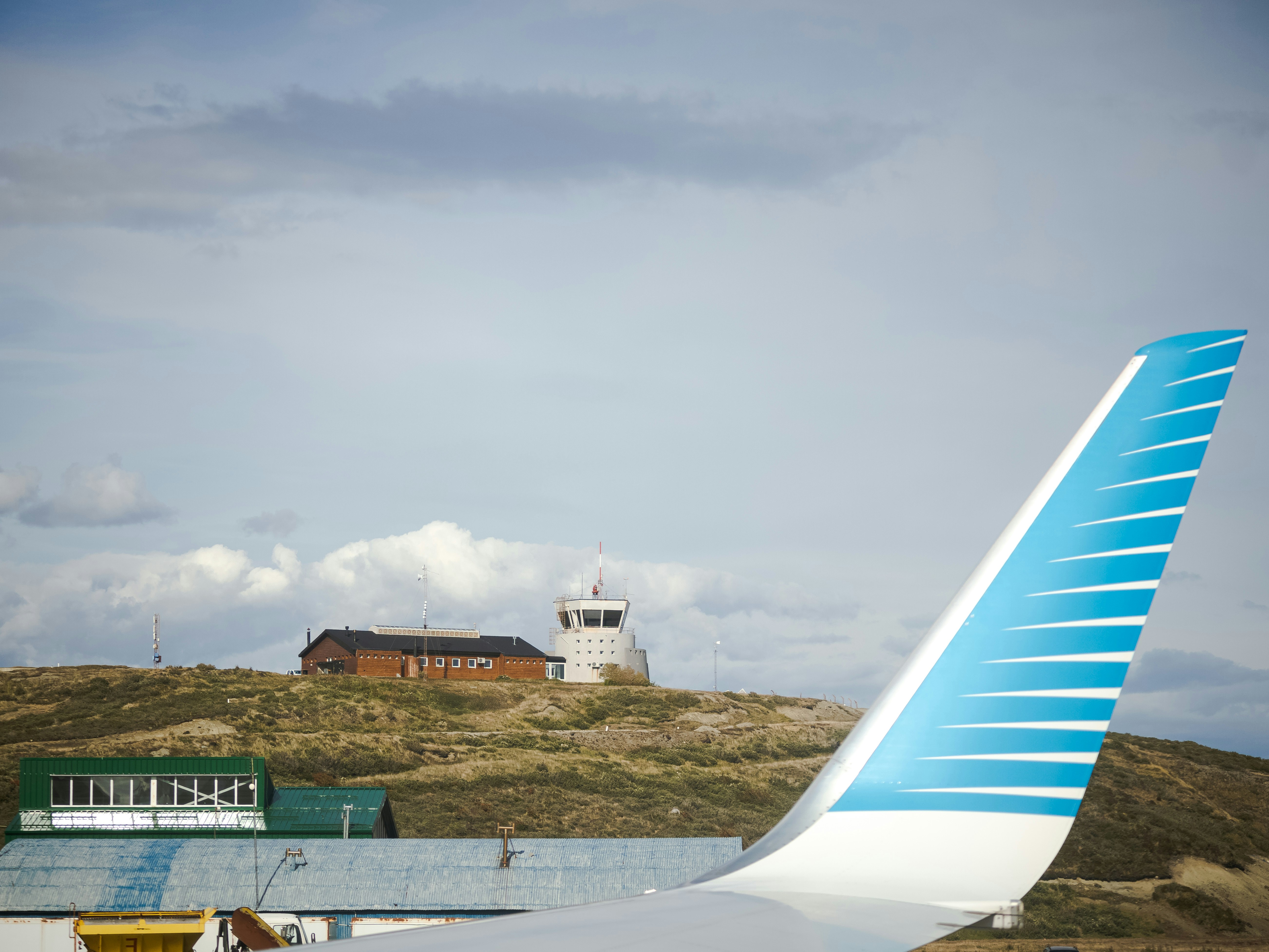 a large jetliner sitting on top of an airport tarmac, Aeroporto de Ushuaia