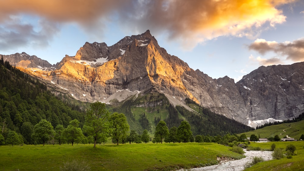 a mountain range with a stream running through it