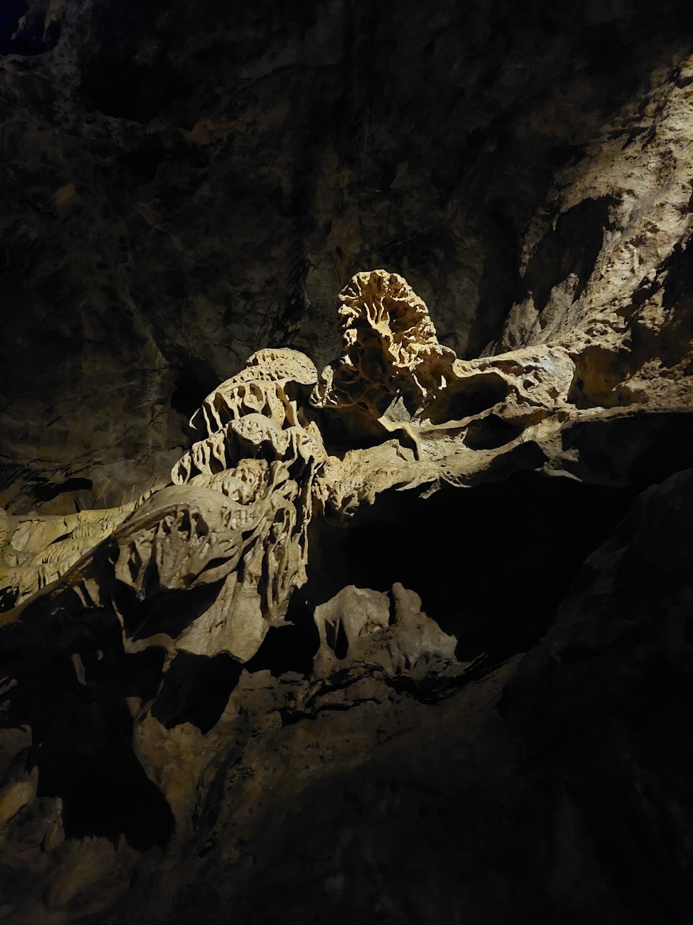 a rock formation in a cave with a light shining on it