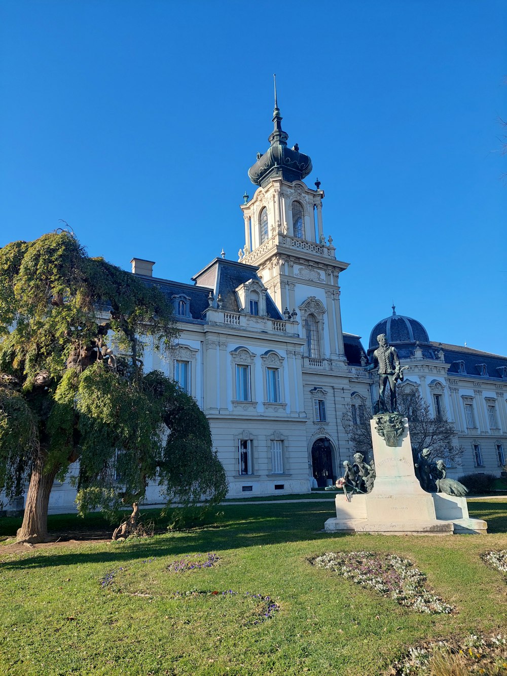 a large white building with a clock tower