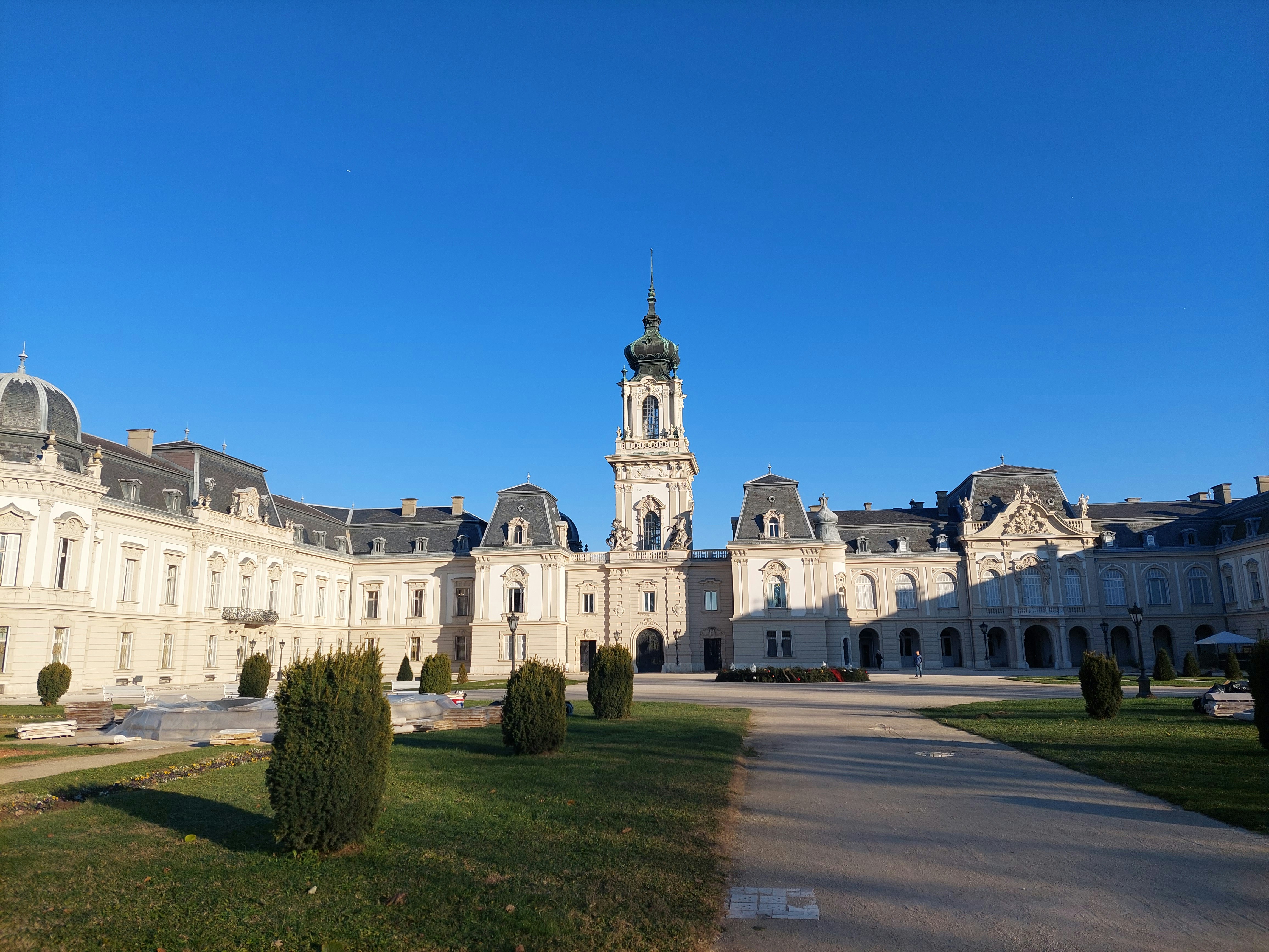 a large white building with a clock tower