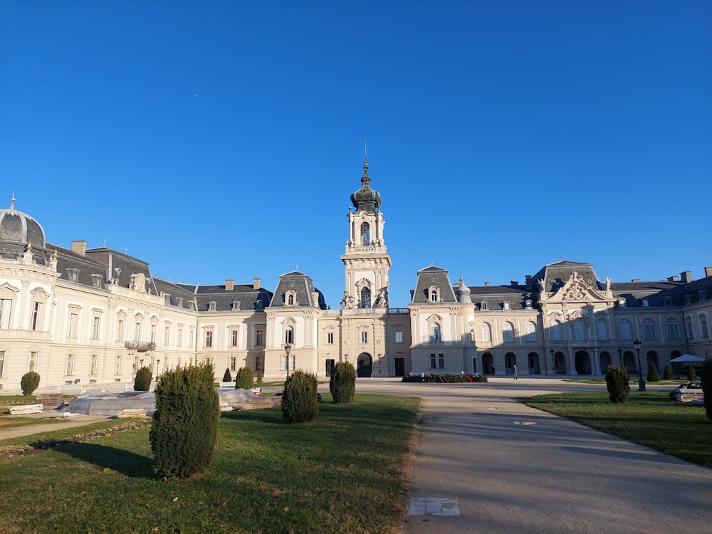 a large white building with a clock tower