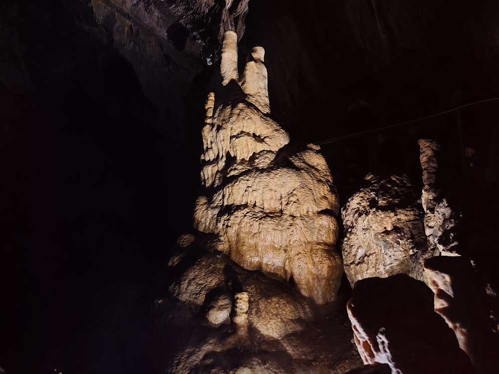 a group of people standing in a cave