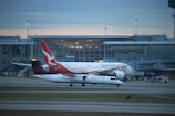 a large jetliner sitting on top of an airport tarmac