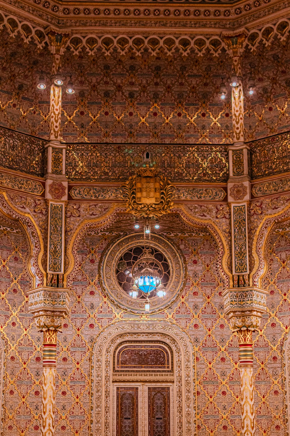 an ornately decorated building with a clock on the wall